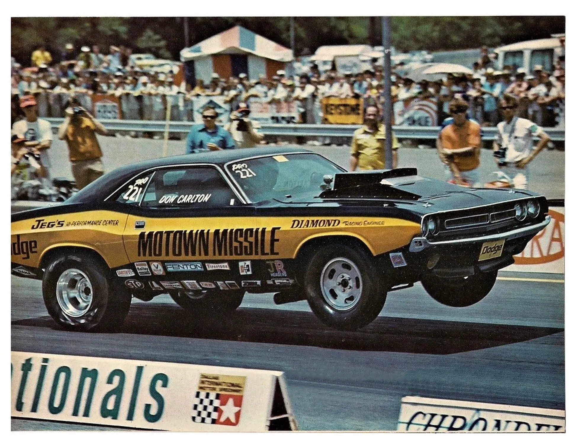 Period racing photograph of the Motown Missile Challenger lifting its front wheels