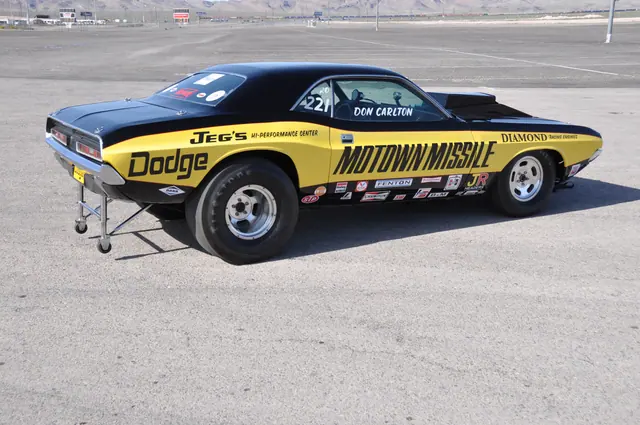 Elevated right-rear three-quarter view of the Motown Missile Challenger with wide slicks and wheelie bars