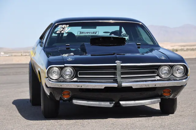 The black-and-yellow Motown Missile Challenger photographed head-on, showing the grille, headlights and raised hood scoop