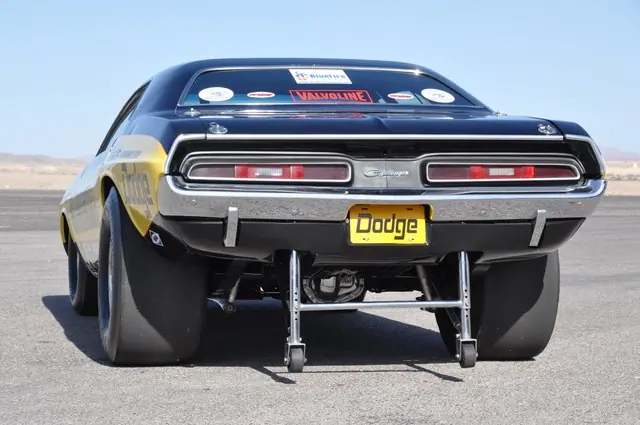 Rear view of the Motown Missile Challenger showing taillights and wheelie bars